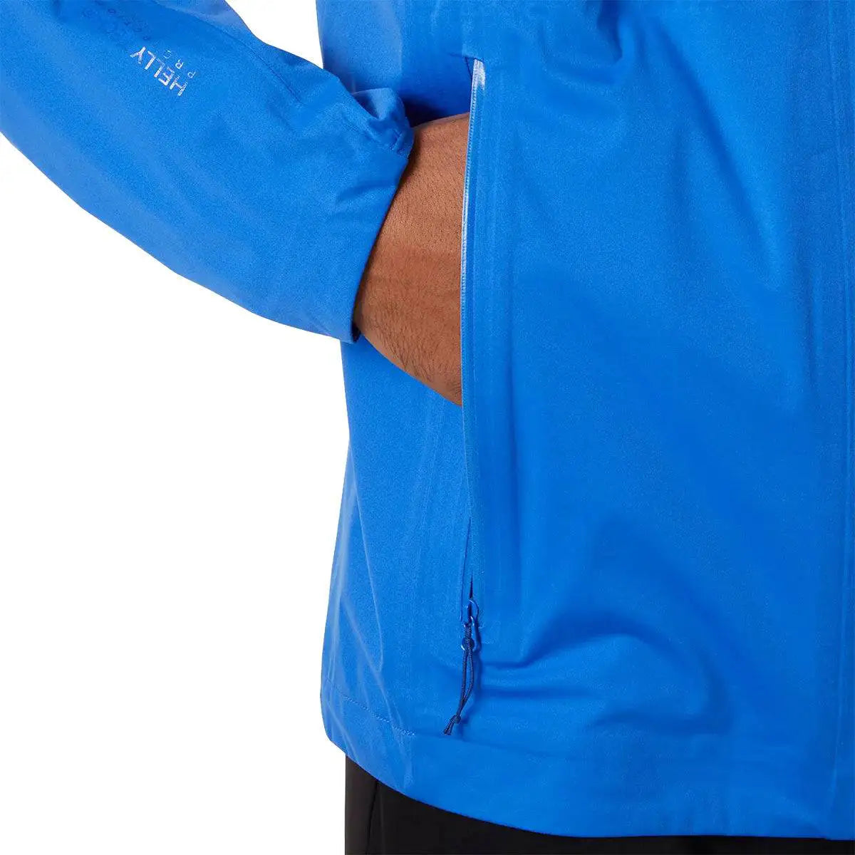 Detail of zippered hand pocket on Helly Hansen Mens Momentum 3 Layer Stretch Waterproof Jacket in blue, designed for secure storage.  from  John Bull Clothing 