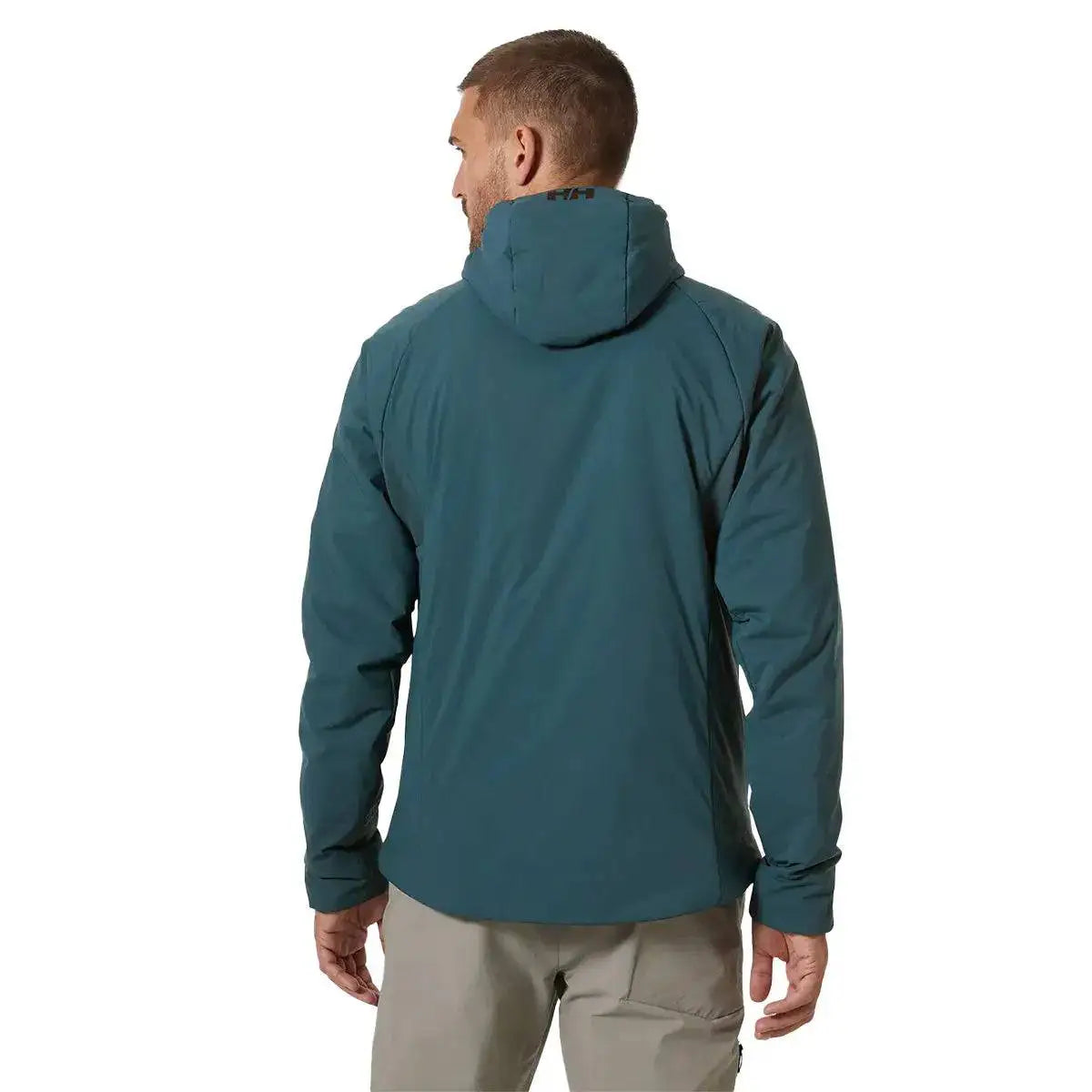 Rear view of a model wearing the Helly Hansen Odin Stretch Hood Insulator 2.0 Jacket, showcasing its ergonomic fit and insulated hood for outdoor performance.  from  John Bull Clothing 
