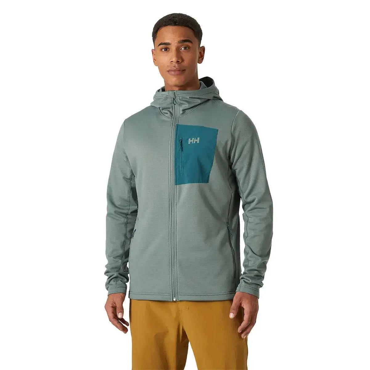 Model wearing the Helly Hansen Versalite Hooded Fleece Jacket in green, displaying the full-zip front, zippered chest pocket, and comfortable fit.  from  John Bull Clothing 
