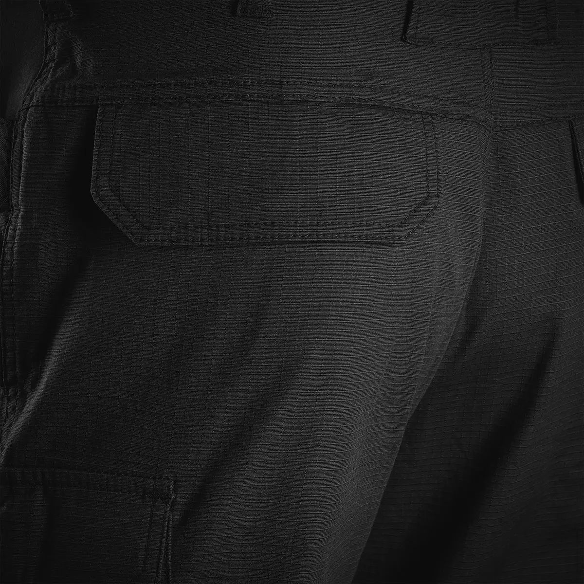 Close-up of the back pocket on Highlander Magnum Teflon Trousers in black, showcasing reinforced stitching and ripstop texture.