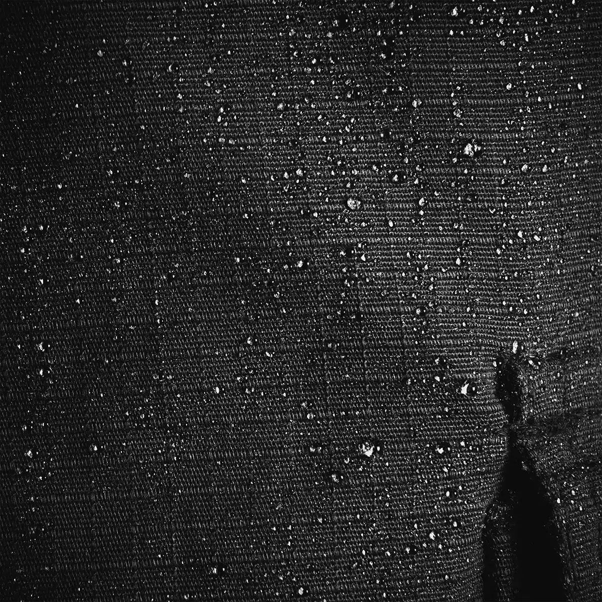 Water droplets on the Teflon-coated ripstop fabric of Highlander Magnum Trousers, demonstrating water-resistant performance.  from  John Bull Clothing 
