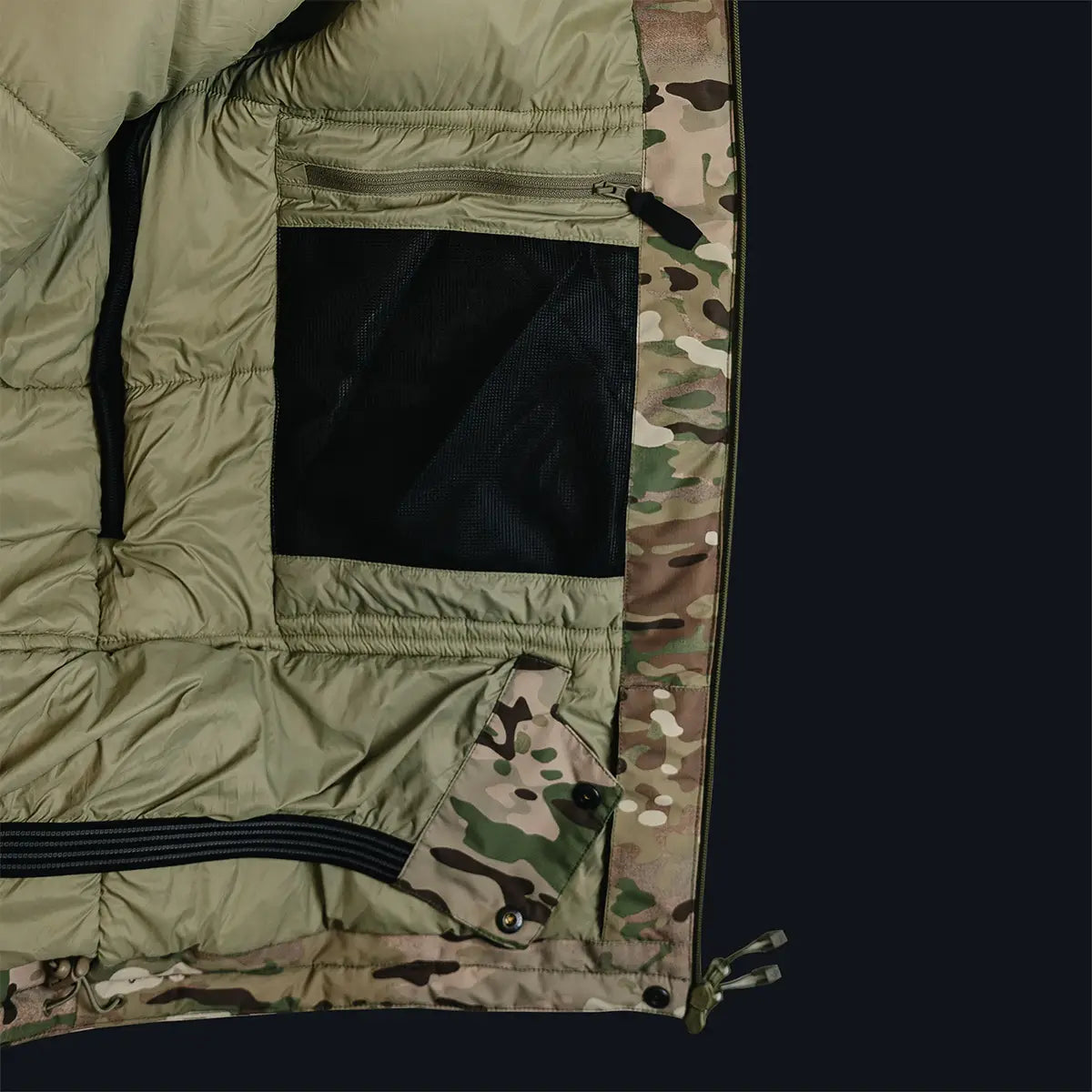 Interior of Stoirm Mission Primaloft Waterproof Jacket Multicam showing mesh pocket and insulated lining for tactical gear storage and warmth.