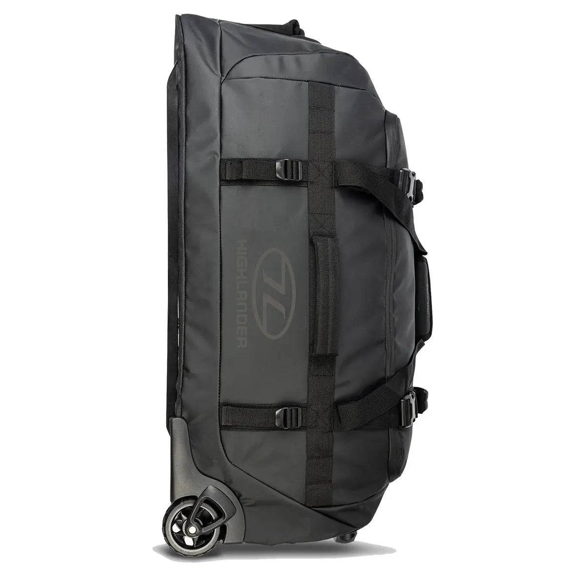 Highlander The Trailer 100 Litre Duffel Bag Black standing upright, featuring heavy-duty straps, robust wheels, and a water-resistant design.