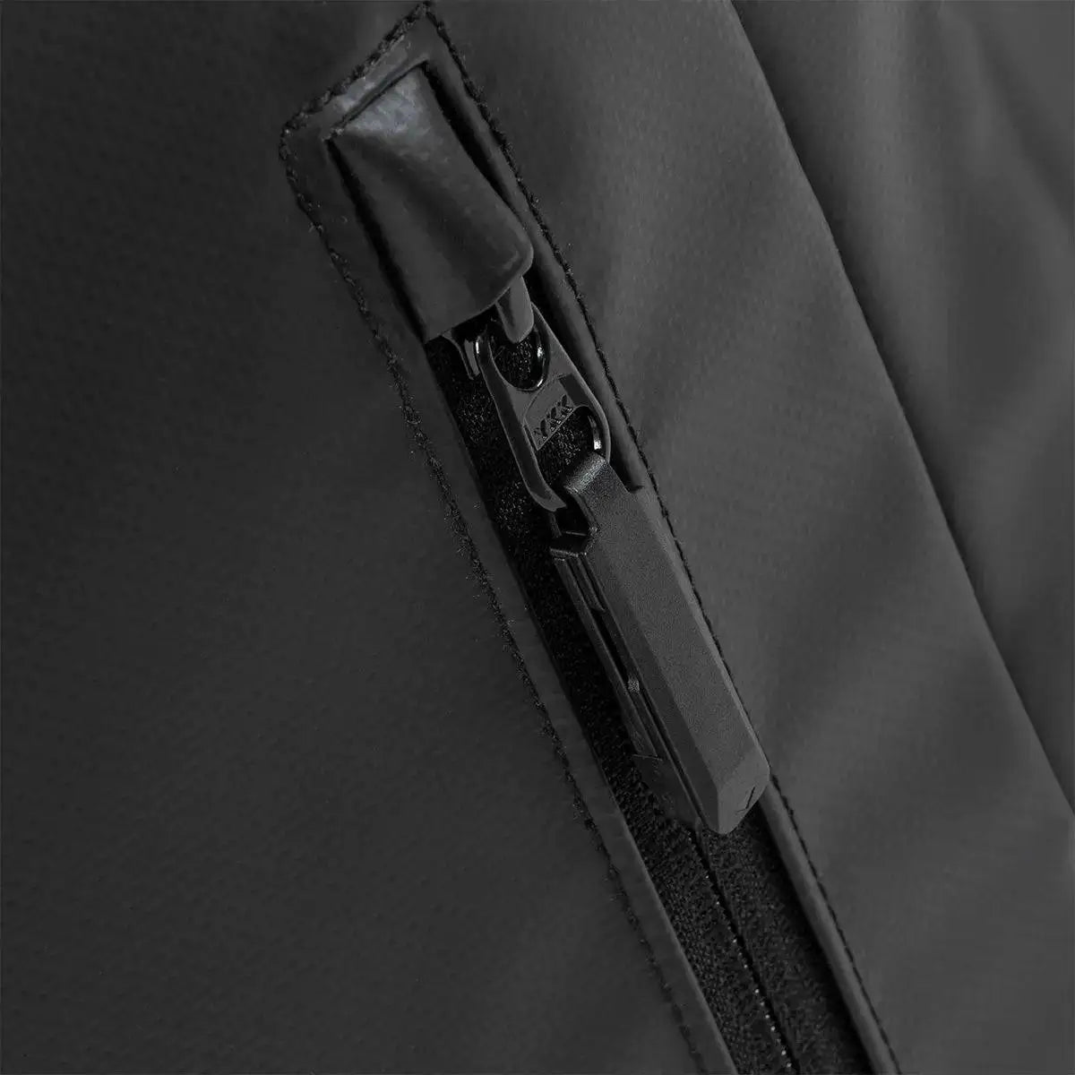 Close-up of Highlander Veltra 44L Cabin Bag Black zipper, showcasing water-resistant material and sturdy zip pull for durability.  from  John Bull Clothing 