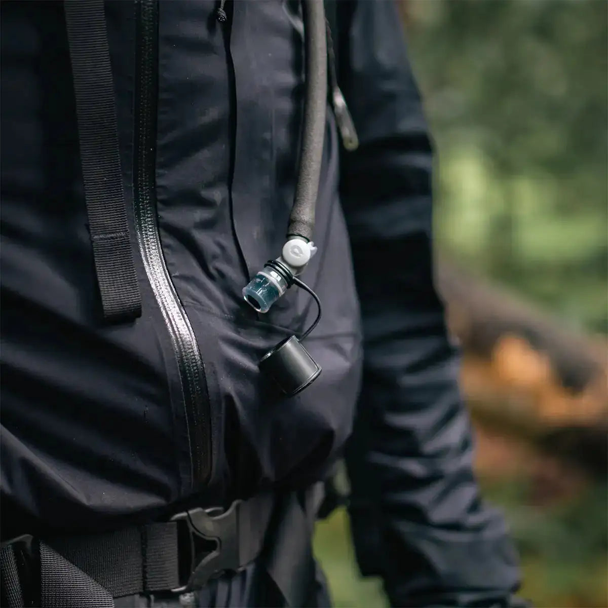HydraPak Force Tactical Grey Water Reservoir hose clipped to tactical jacket, perfect for hands-free hydration | John Bulls  from  John Bull Clothing 