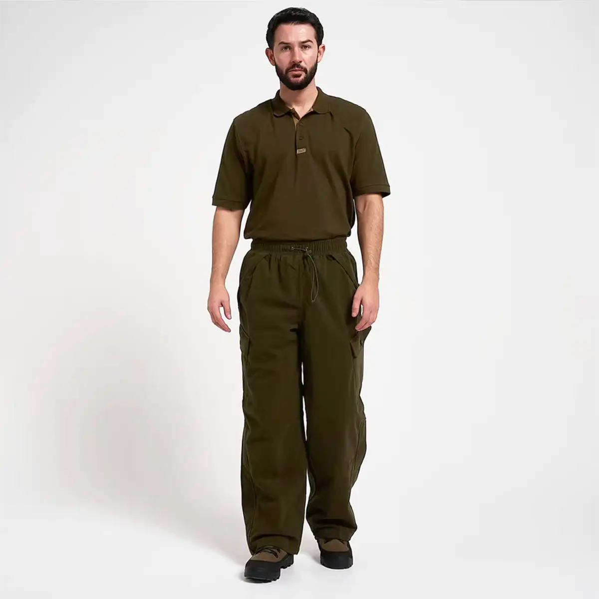 Full body view of model wearing Jack Pyke Hunters Trousers Green Waterproof, showcasing outdoor-ready design and fit.
