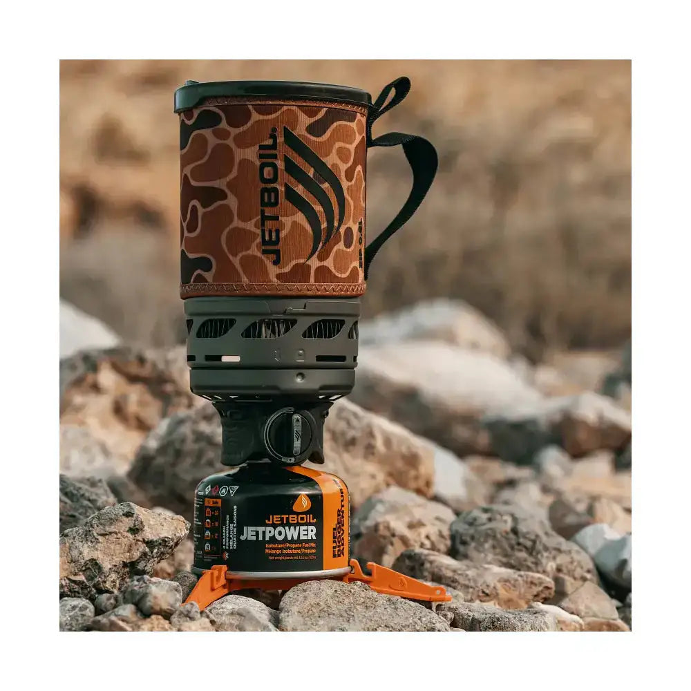 Jetboil Zip Duck Camo 0.8L camping stove set on rocks  from  John Bull Clothing 