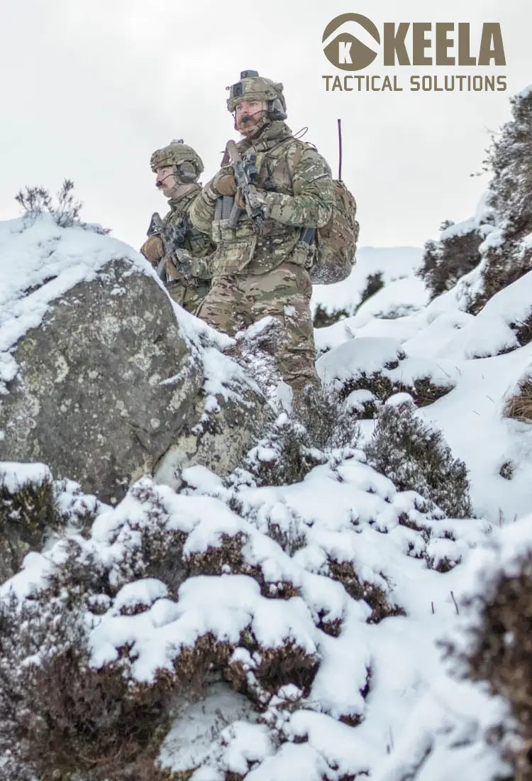 Two British Soliders wearing Keela Mk6 Belay jackets during operation in heavy snow