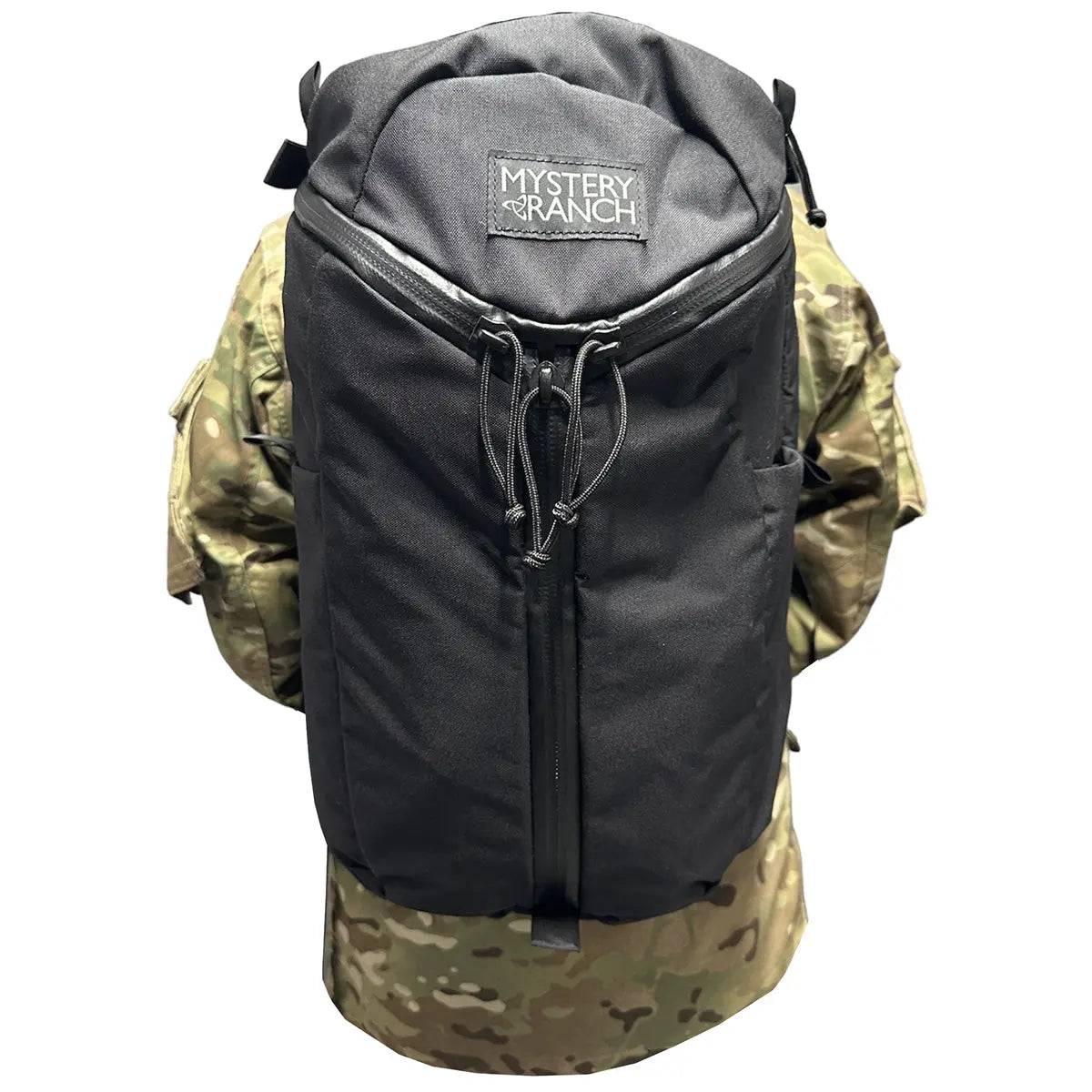 Black tactical backpack before fitting the Luminae Daysack Scrim Cover MTP, showcasing its original design and structure for comparison.