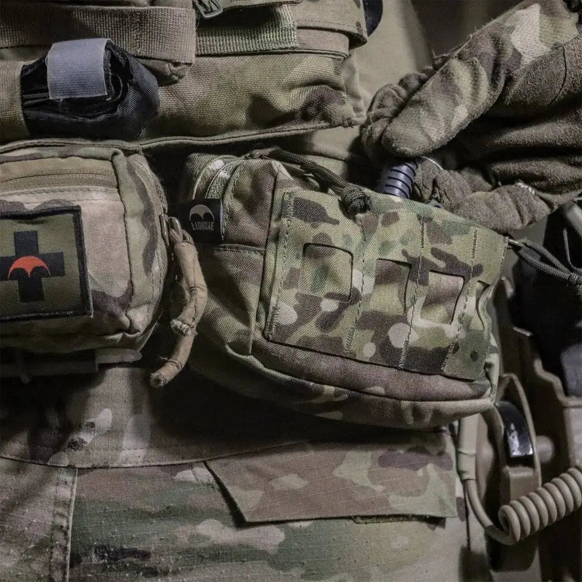 Luminae Multicam Small GP Pouch MTP attached to a tactical vest, demonstrating its practical design for military and outdoor applications.  from  John Bull Clothing 