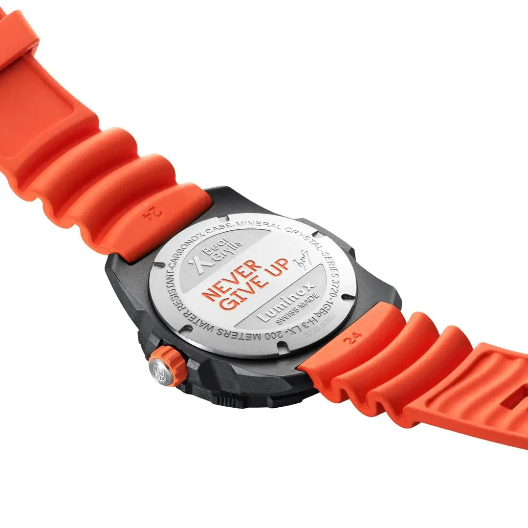 Back view of Luminox Bear Grylls Survival Explorer Watch 42mm XB.3729.NGU with engraved 'Never Give Up' motto and orange strap detail.