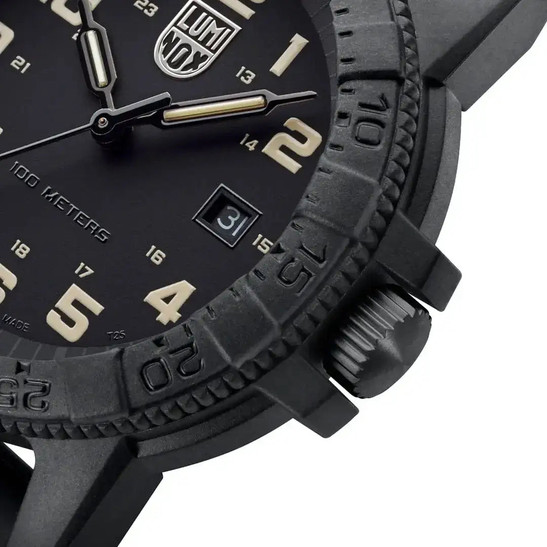 Close-up of black Luminox Leatherback Sea Turtle Giant 44mm outdoor watch with beige luminous hands, date window, and textured bezel