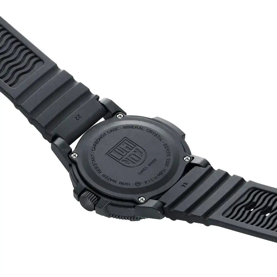 Back view of black Luminox Leatherback Sea Turtle Giant 44mm watch showing mineral crystal case, textured rubber strap, and engraved case back with logo - SKU: JB1655