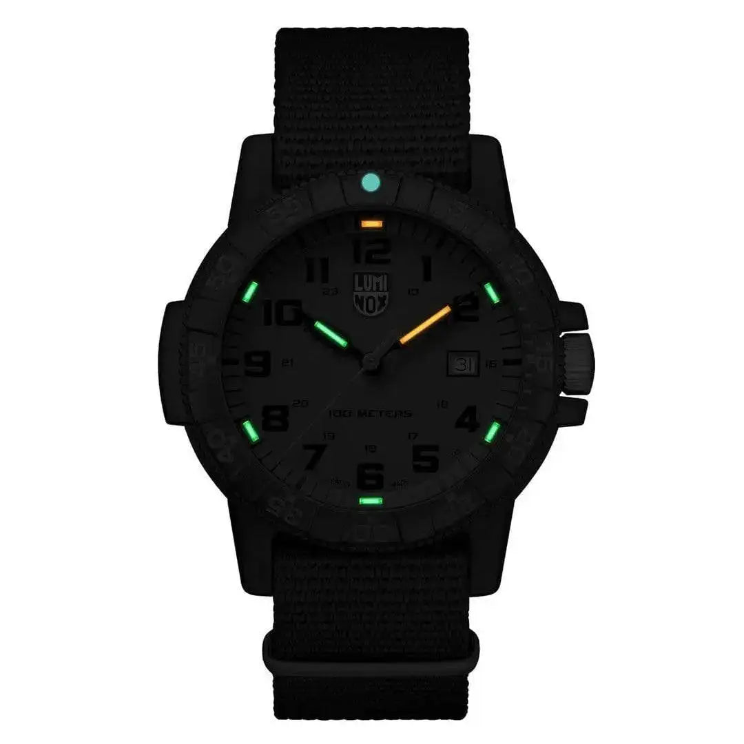 Luminox Leatherback Sea Turtle Giant 0320 Series Watch glowing in the dark with green and orange luminescent markers for enhanced visibility.  from  John Bull Clothing 