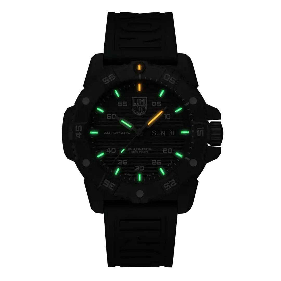 Luminox Master Carbon Seal Automatic 3860 Series Diver's Watch glowing in the dark with green and orange luminescent markers for night visibility.