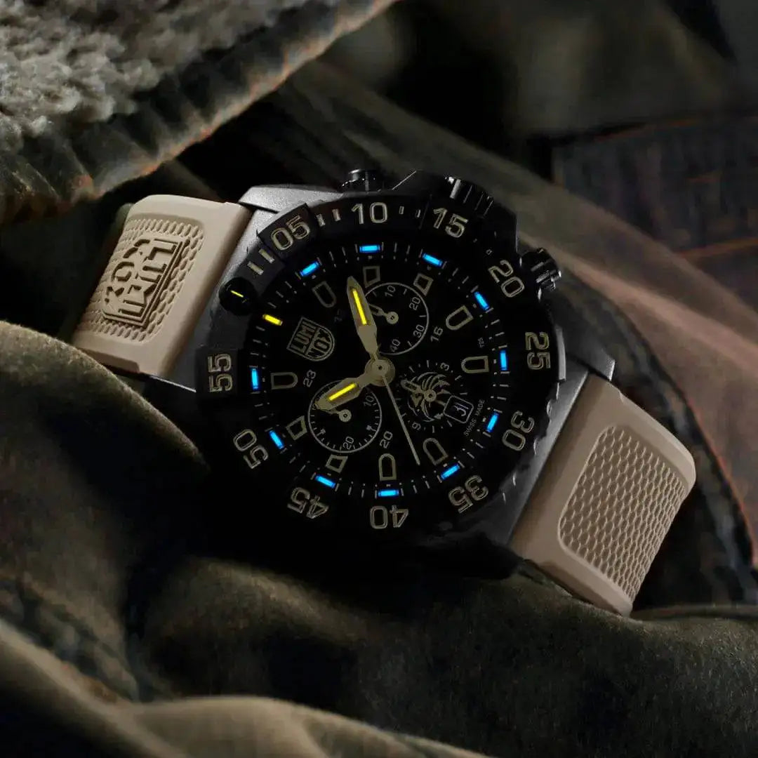 Luminox Navy SEAL Foundation Chronograph Dive Watch placed on tactical gear, emphasizing its rugged and military-inspired design.  from  John Bull Clothing 