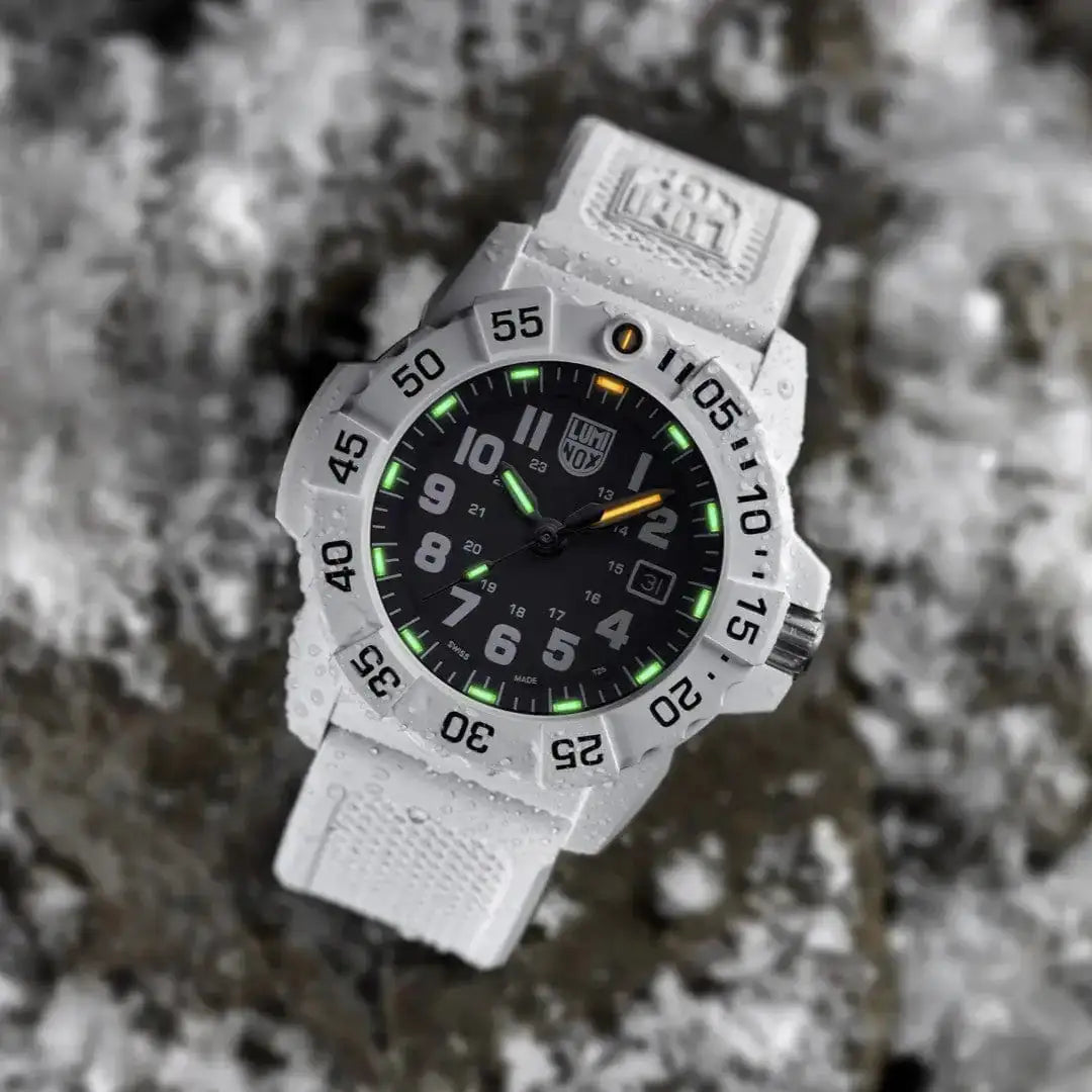 Luminox Navy Seal White Military Dive Watch 45mm XS.3507.WB displayed on icy terrain, highlighting its durability in extreme cold conditions.  from  John Bull Clothing 
