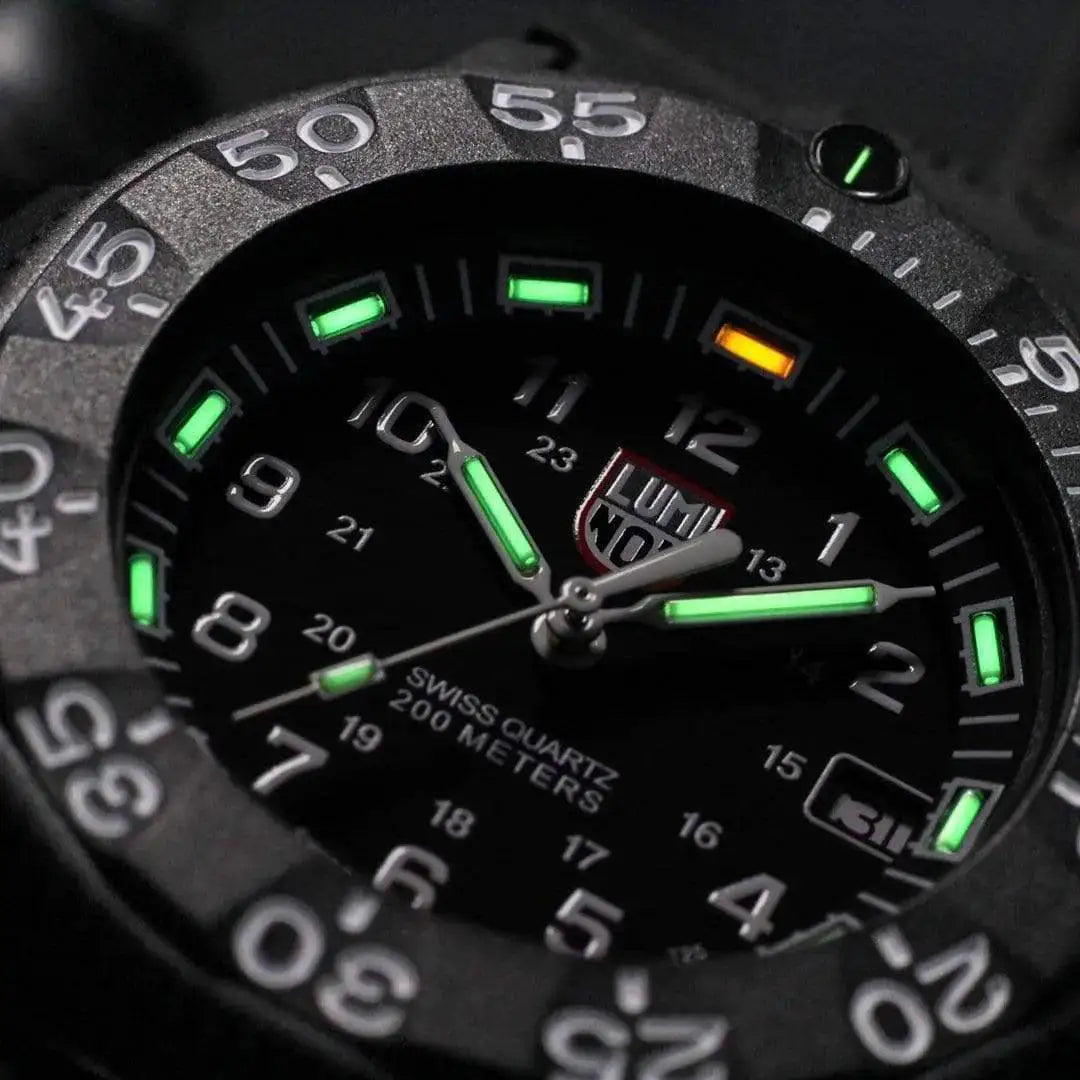 Close-up of Luminox Navy Seal 3000 Series Diver Watch XS.3001.F highlighting its tritium gas tube illumination and durable black CARBONOX case.  from  John Bull Clothing 
