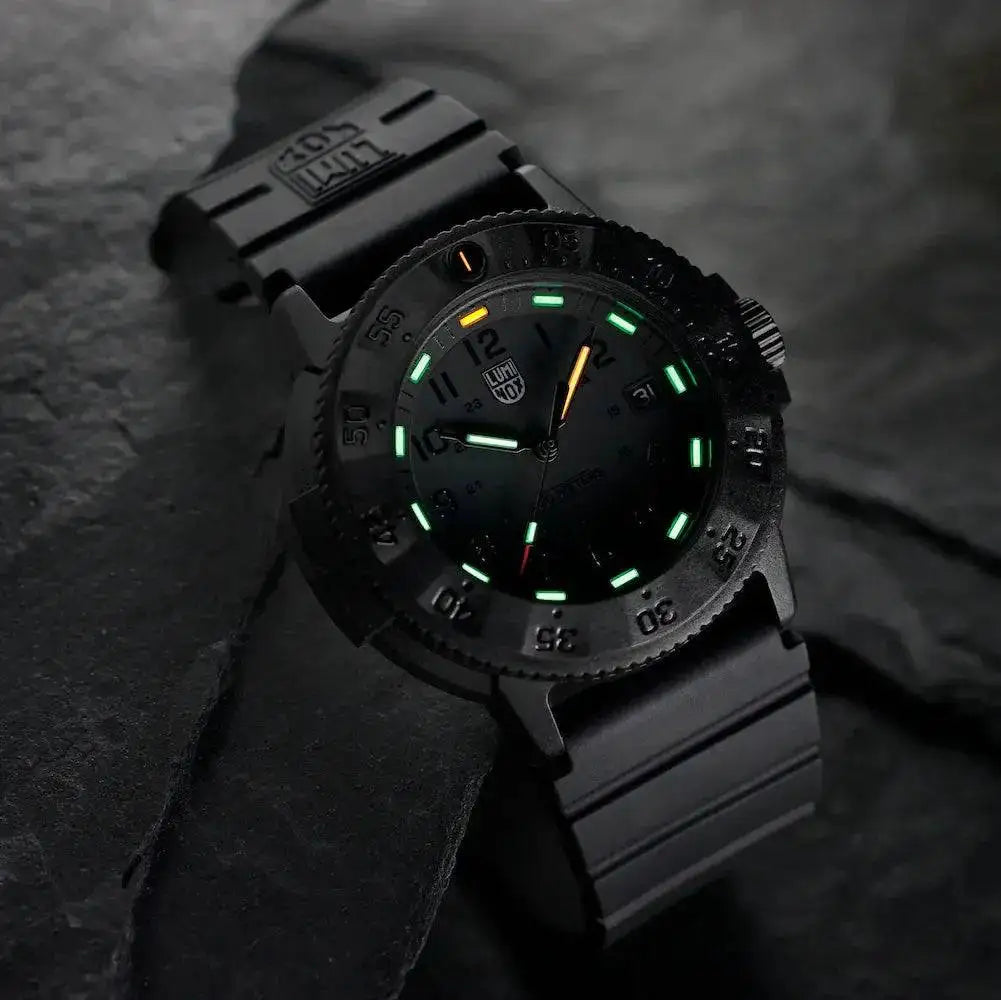 Luminox Original Navy Seal 3000 Series Watch glowing in the dark, featuring tritium illumination for enhanced readability in low-light conditions.  from  John Bull Clothing 