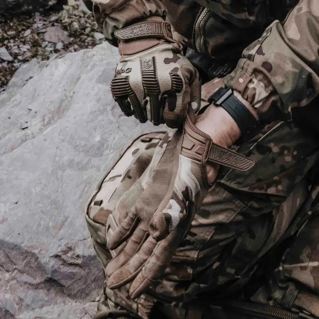 MoG Target High Abrasion Ergoshield Gloves in Multicam worn by tactical operator, highlighting secure wrist closure and ergonomic fit for mission readiness.  from  John Bull Clothing 