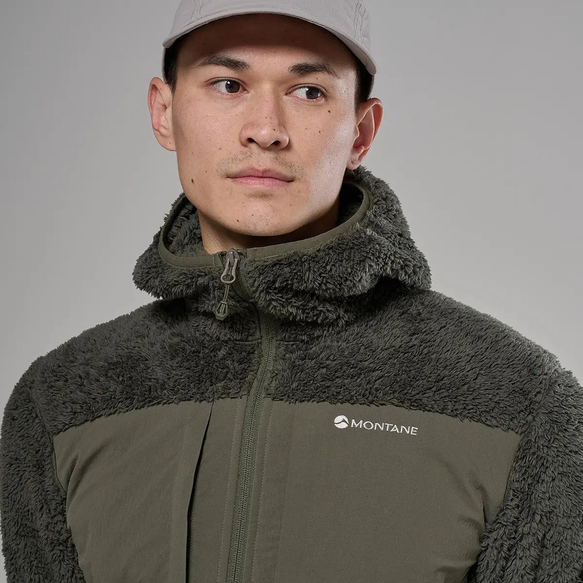 Male model in a dark grey fleece jacket with a plush, textured hood and high collar, designed for cold weather outdoor activities - SKU: JB1618-MO-S