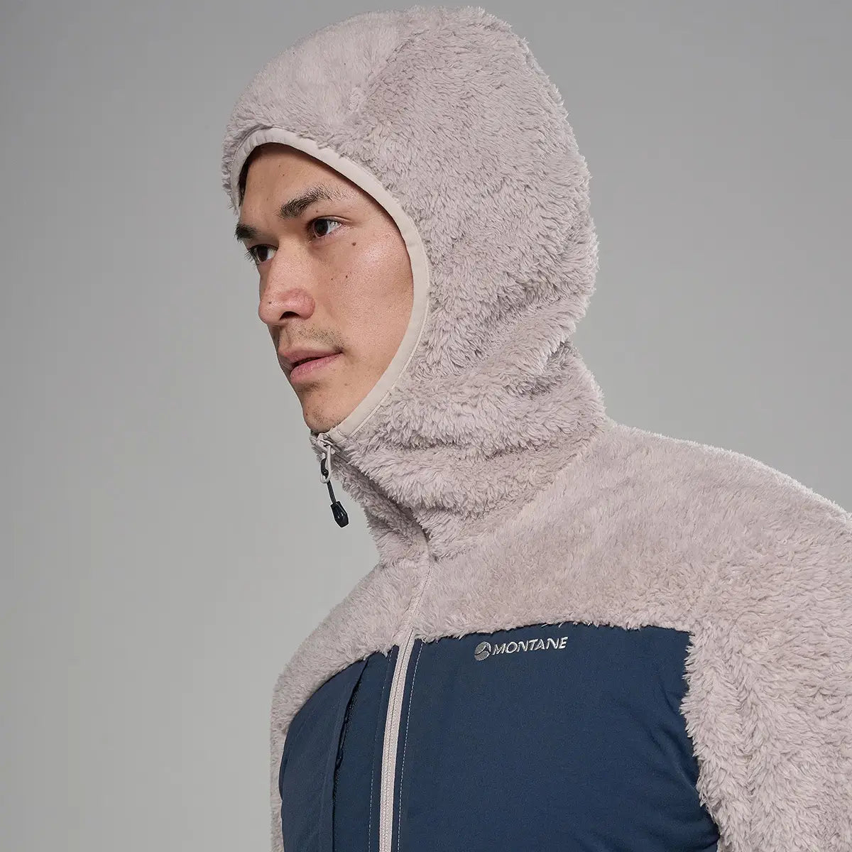 Male model in a navy blue fleece jacket with contrasting plush fleece shoulders and chest, featuring a high collar and logo detail for outdoor wear - SKU: JB1618-MO-S
