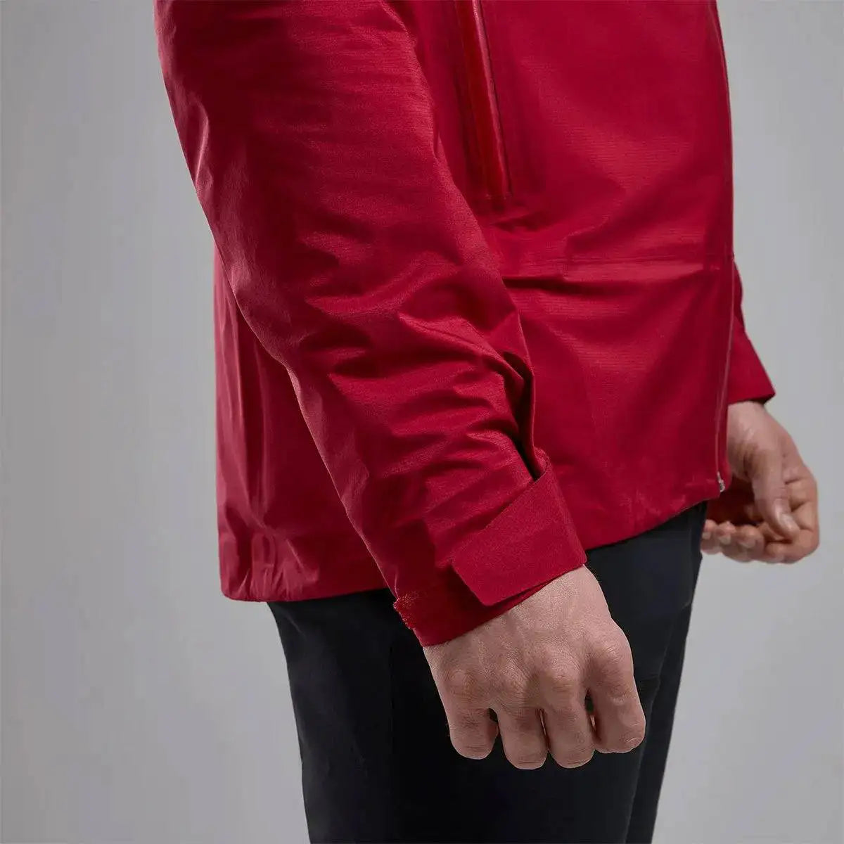 Detailed view of Montane Mens Cetus Lite Waterproof Jacket in red, showcasing the adjustable cuff design for a secure and comfortable fit.  from  John Bull Clothing 