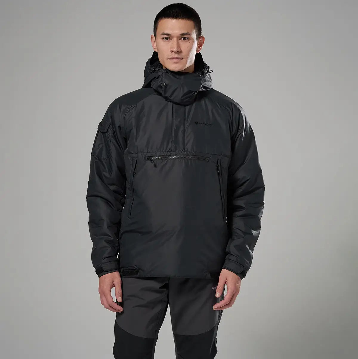 Model wearing black Montane Extreme Smock Insulated Mens jacket, highlighting fit and functionality for outdoor use, sold by John Bull Clothing.
