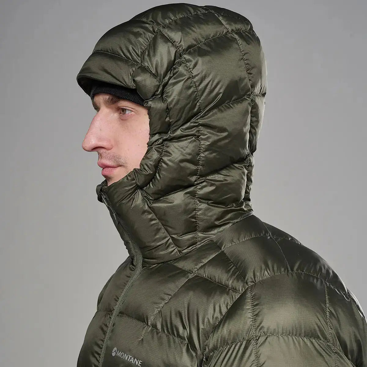 Montane Mens Icarus 3.0 Hooded Insulated Jacket in dark green, lightweight nylon material with quilted puffer design, hood with adjustable drawstrings, ideal for outdoor cold weather activities - SKU: JB1616-MO-S