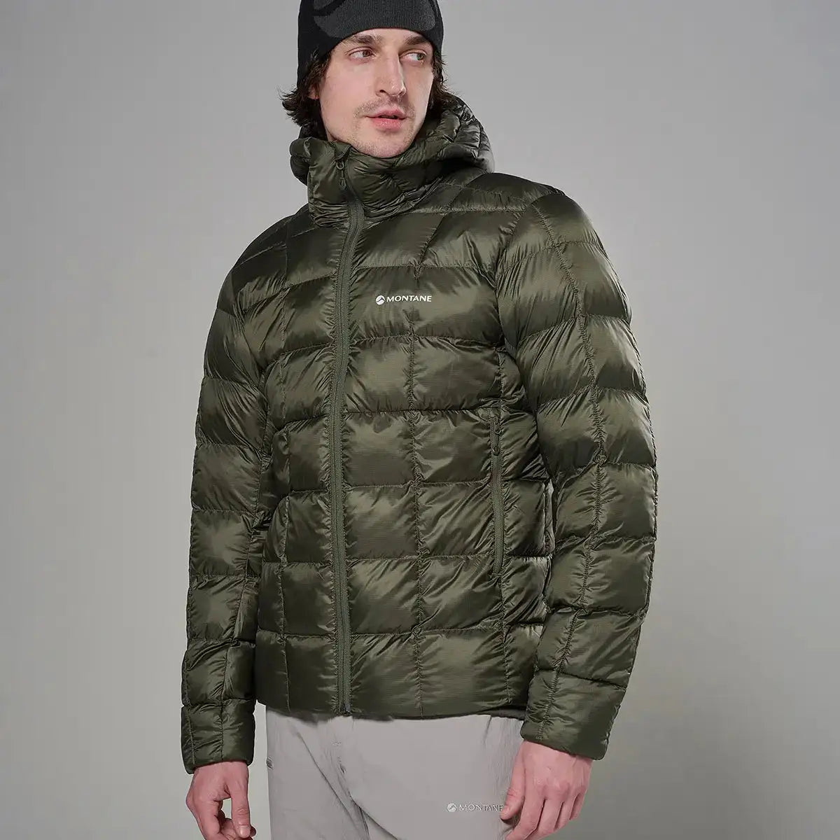 Montane Mens Icarus 3.0 Hooded Insulated Jacket in olive green, lightweight puffer style with front zipper, hood, and brand logo on chest