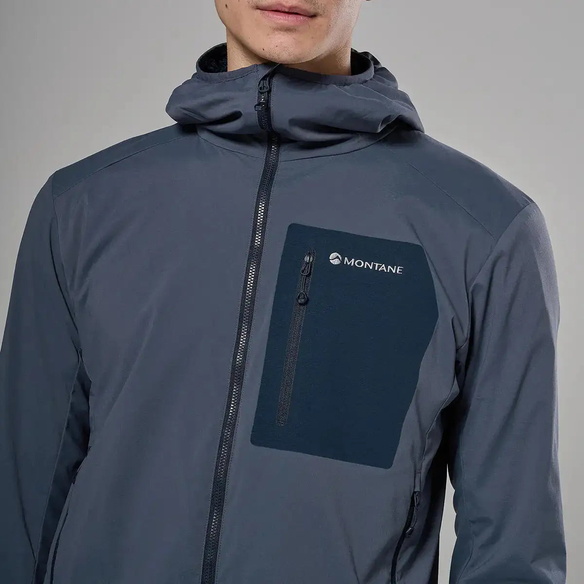 Montane men's lightweight softshell hooded jacket in dark gray with front zipper and chest pocket, designed for outdoor activity and protection