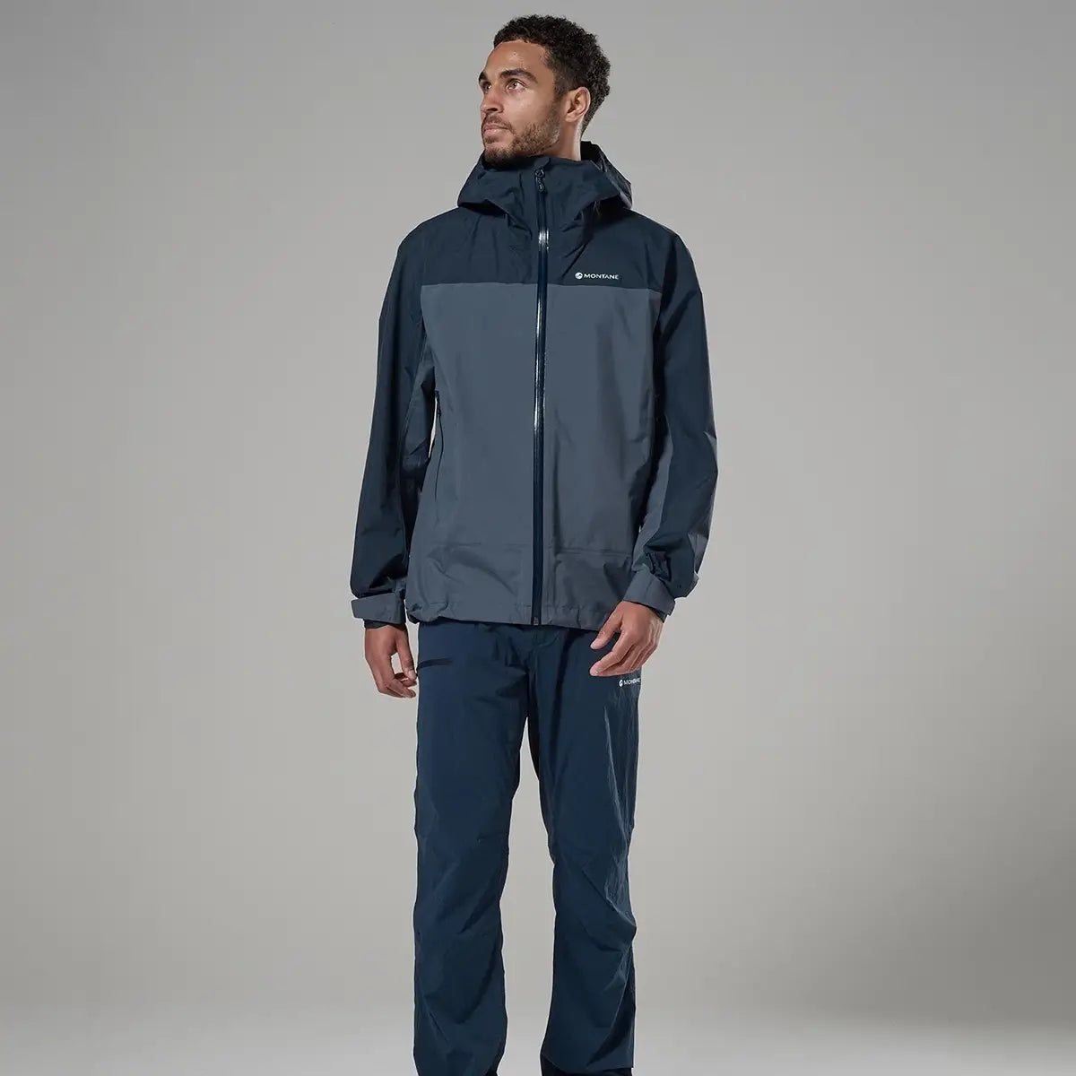 Montane waterproof jacket for men in navy and grey, outdoor raincoat with hood