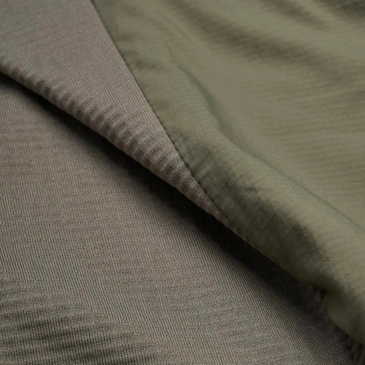 Fabric detail of Montane Mens Sirocco Hooded Insulated Jacket showing texture and quality of PrimaLoft Gold Active insulation.  from  John Bull Clothing 