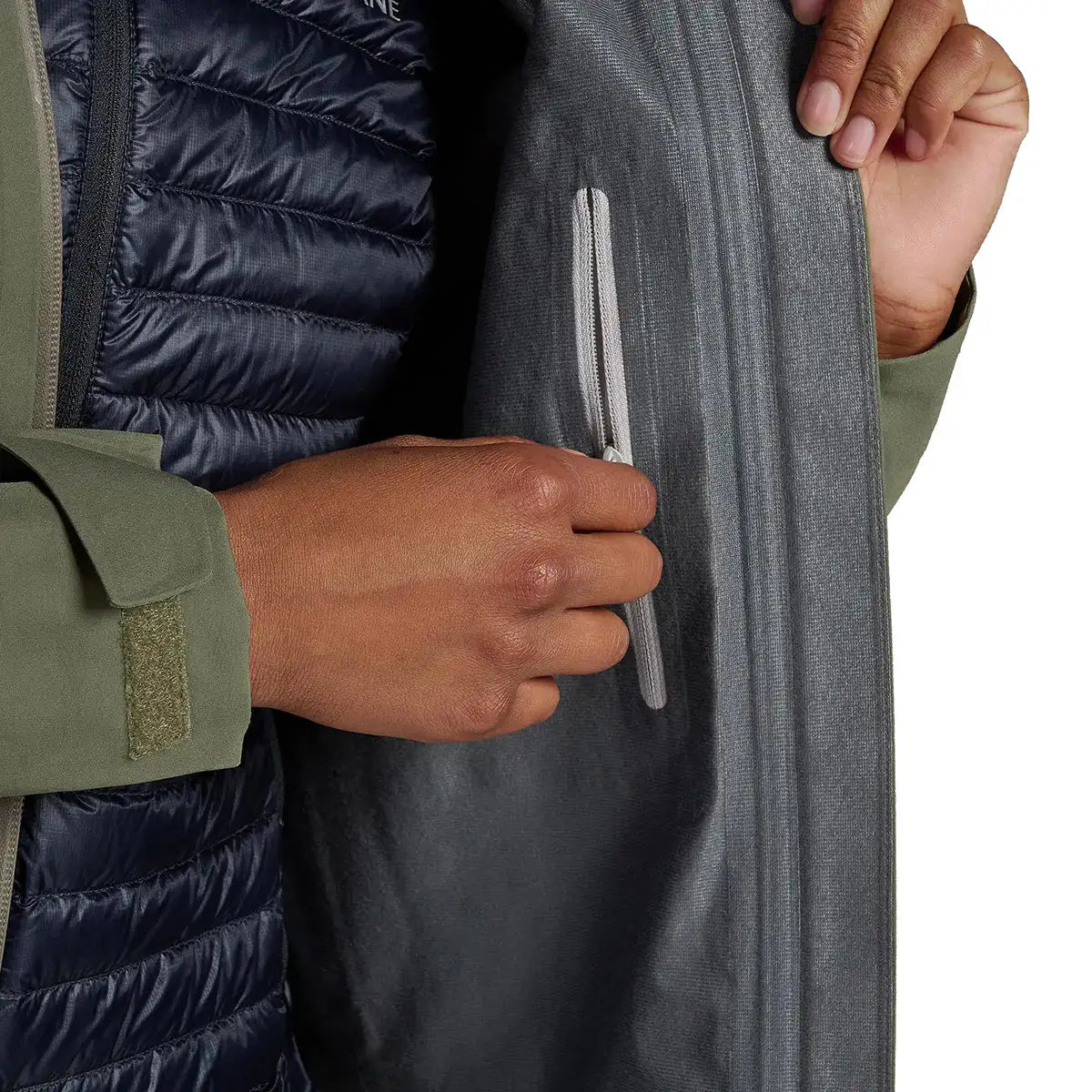Interior pocket detail of Montane Womens Spirit Long Goretex Waterproof Jacket, showing zippered storage and inner lining texture.  from  John Bull Clothing 
