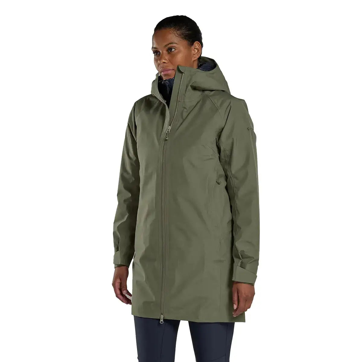 Model wearing Montane Womens Spirit Long Goretex Waterproof Jacket in Caper green, showcasing fit and coverage for wet weather conditions. Caper from  John Bull Clothing 