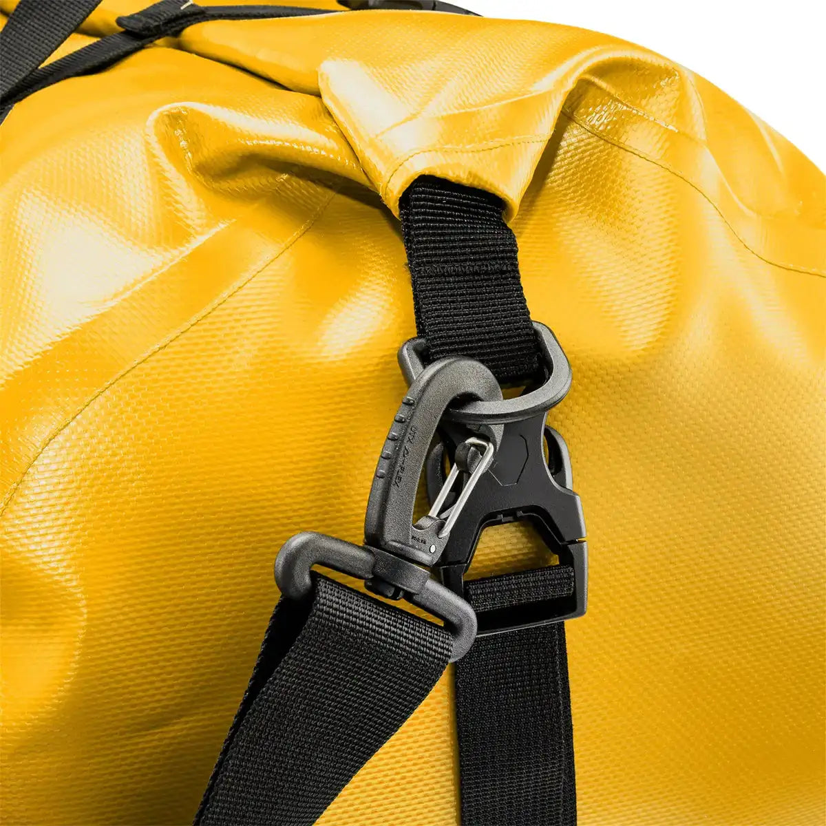 Detail of yellow Ortlieb Rack Pack 31L Waterproof Duffle Bag showing heavy-duty strap clip for secure shoulder strap attachment.  from  John Bull Clothing 