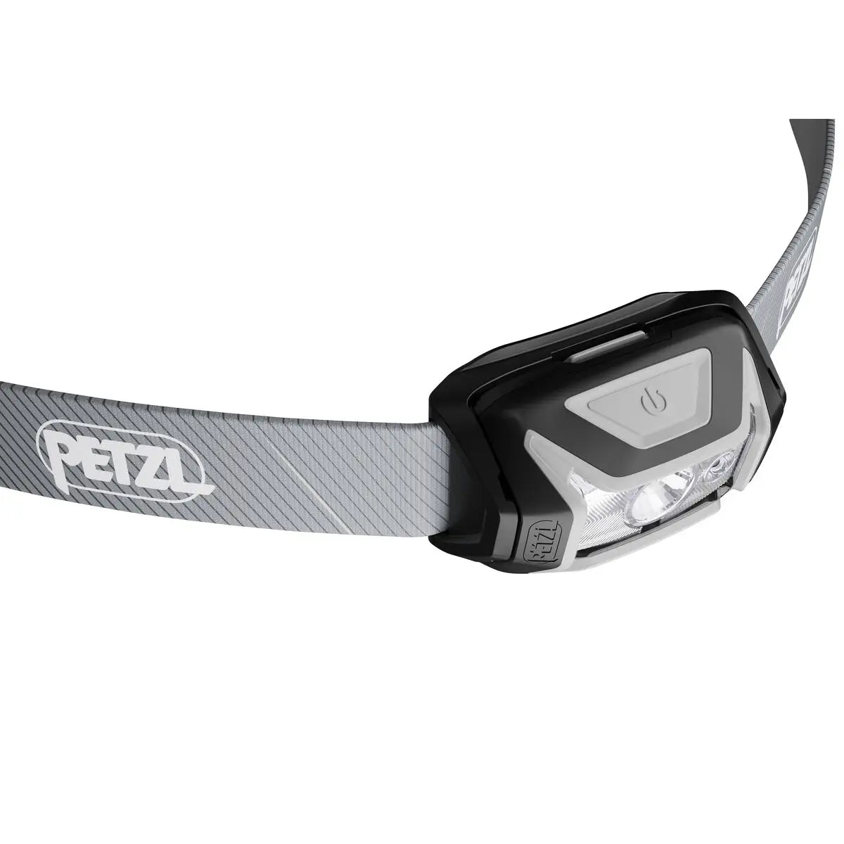 Angled view of Petzl Tikka Core Headtorch with Red Light 450 Lumens in grey, highlighting power button and lens design.