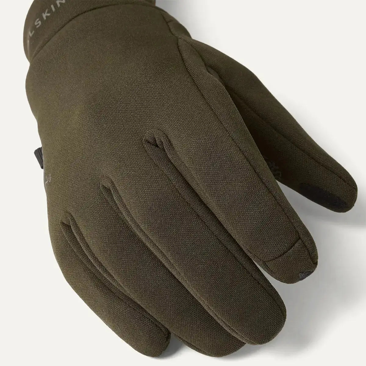 Close-up of dark green waterproof soft shell glove showing textured grip on palm and fingers, flexible and durable material