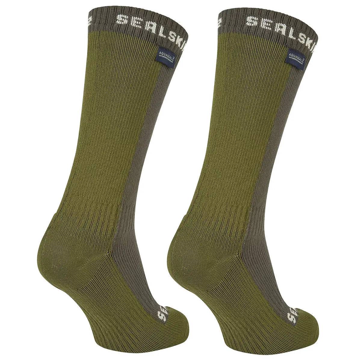 Rear view of SealSkinz Starston Waterproof Cold Weather Mid Length Socks in olive green, showcasing ribbed texture and reinforced heel for durability and comfort.