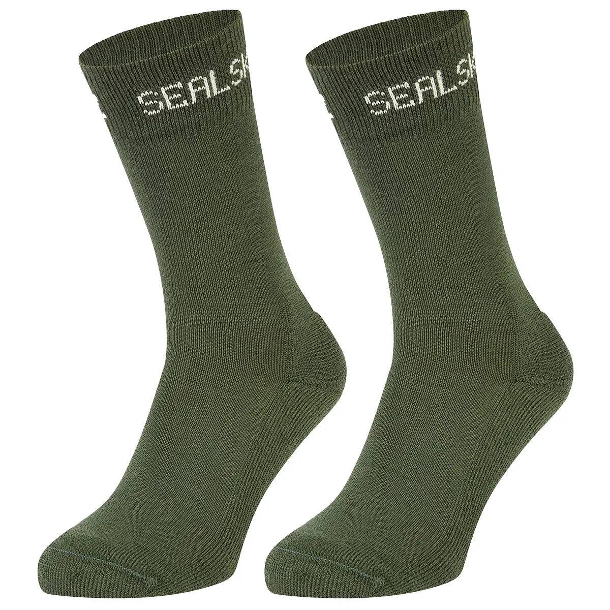 SealSkinz Suffield Solo Merino Liner Sock in olive green, crafted for versatility and warmth. Perfect for outdoor activities in various conditions.