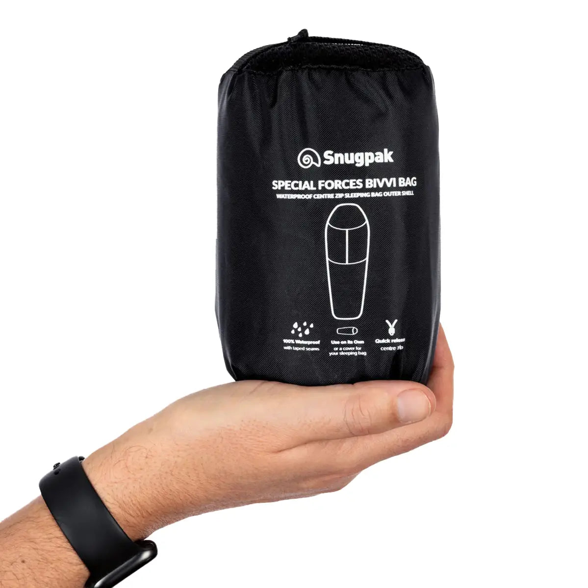 Snugpak Special Forces Waterproof Bivvi Bag WGTE in black compression sack held in hand, highlighting its portable and quick-release camping design.