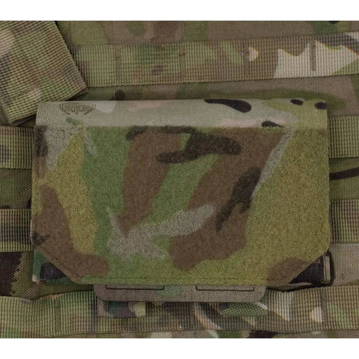 Spectre Admin Sleeve Multicam securely mounted on MOLLE webbing, showcasing its compact tactical design for field use.  from  John Bull Clothing 