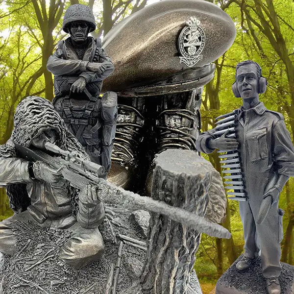 A large outdoor memorial-style sculpture featuring multiple soldier and officer figures in metallic gray tones, including a seated sniper, a standing soldier, a helmeted figure, and a radio operator with a bullet belt, set against a blurred forest background.