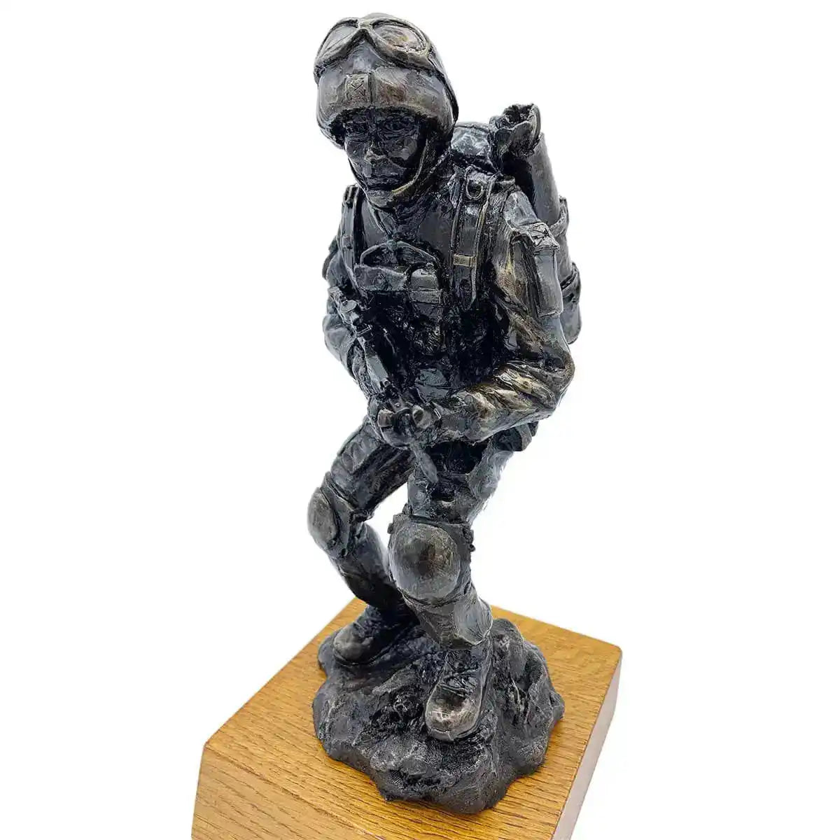 Angled top view of Afghan Medic Bronze Resin Statue on oak base, showcasing intricate craftsmanship for military gift or home sculpture.  from  John Bull Clothing 