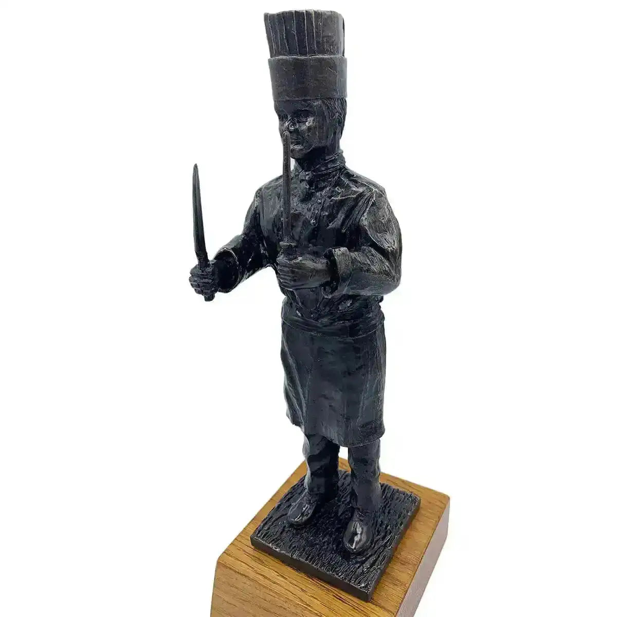 Angled view of Army Chef Statue Bronze Resin | John Bull Clothing depicting a chef in uniform with knife and sharpening steel, ideal for gifting - John Bull Clothing