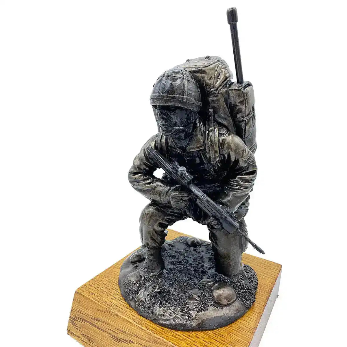 Angled front view of Bronze Resin Kneeling Signaller Statue with SA80 rifle and tactical gear on oak base | John Bull Clothing  from  John Bull Clothing 