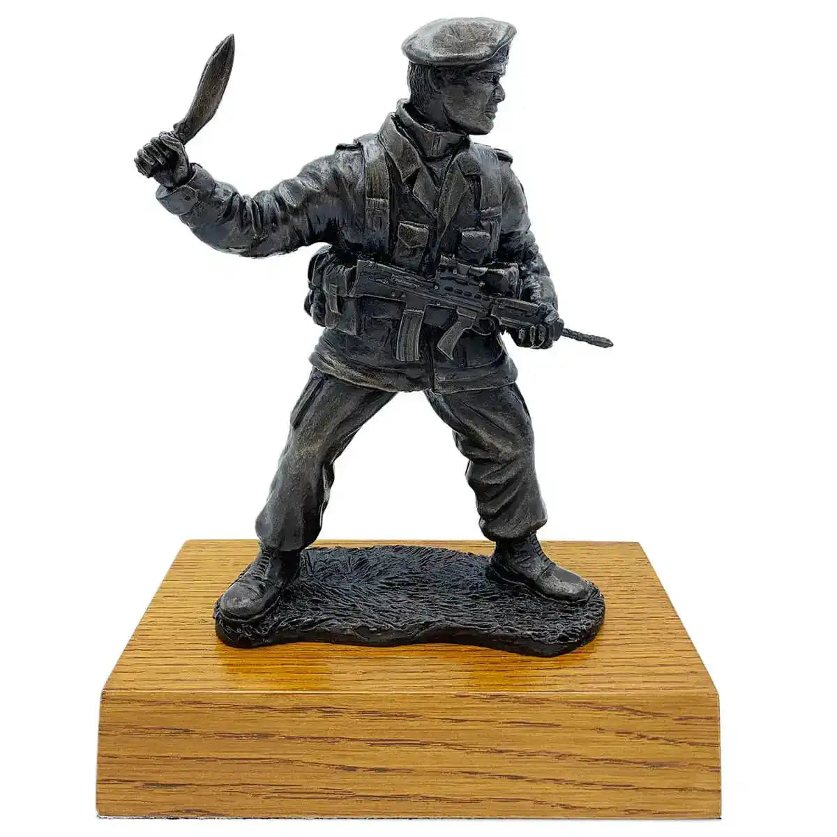 Gurkha with Kukri bronze resin statue on wooden base, depicting a detailed soldier in combat stance holding a kukri and rifle. Ideal for military decor.  from  John Bull Clothing 