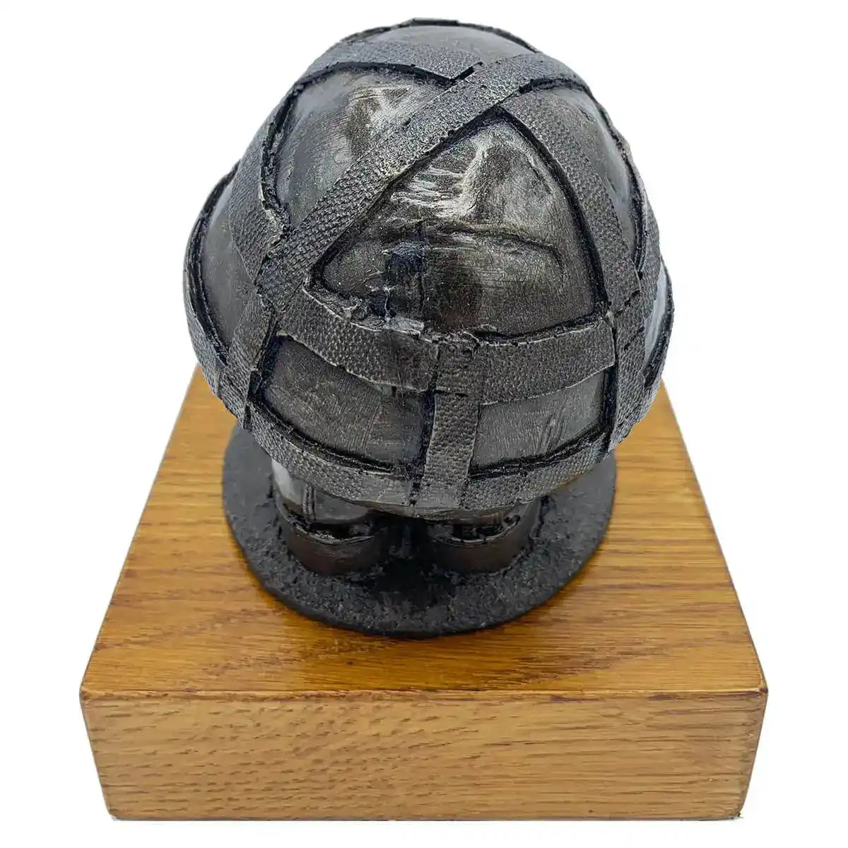 Rear view of Helmet & Boots Statue Bronze Resin | John Bull Clothing, showcasing helmet texture and resin finish on wooden platform.  from  John Bull Clothing 