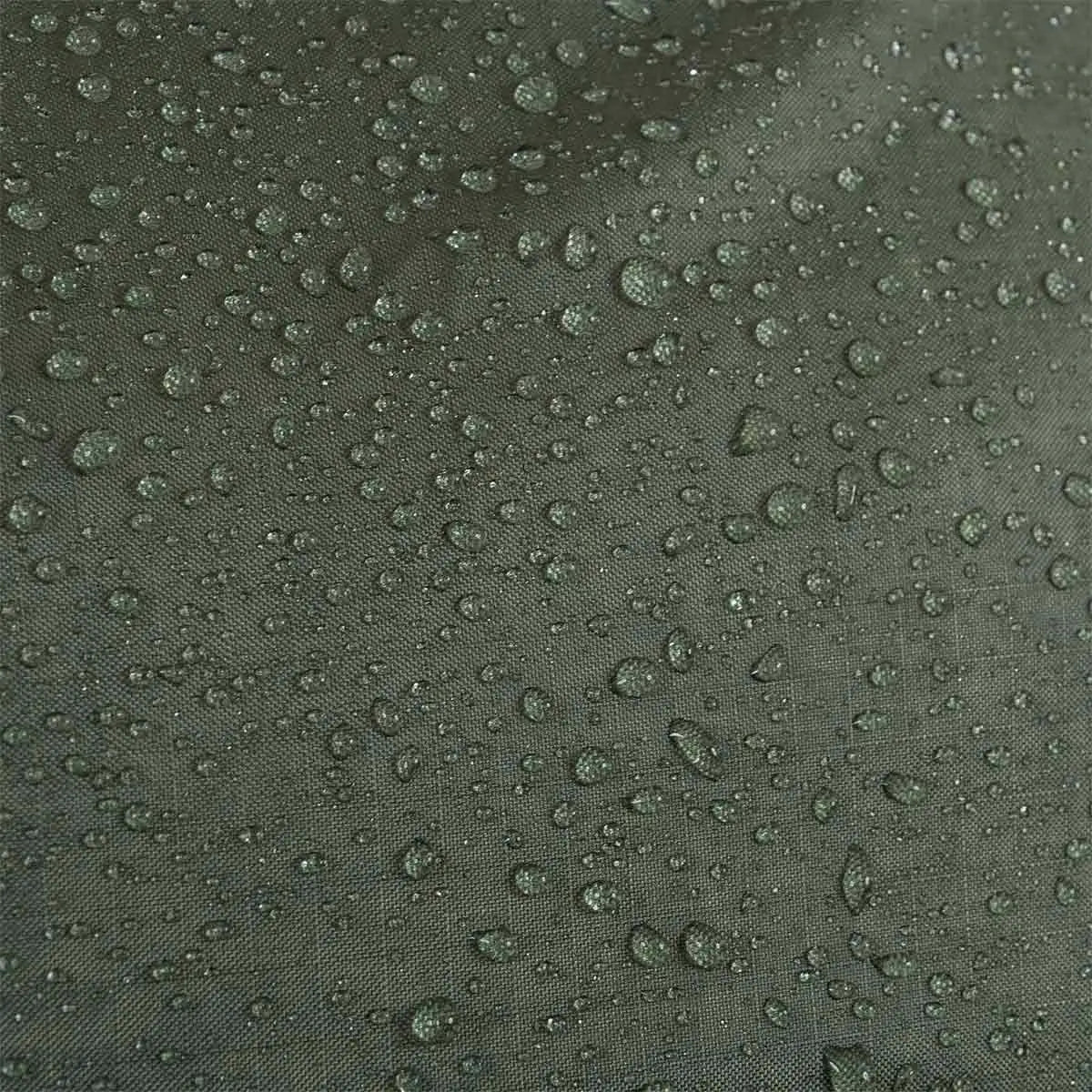 Close-up of the Highlander Rucksack Cover 80-90L in Olive Green with water droplets, showcasing its waterproof material for ultimate weather protection.  from  John Bull Clothing 