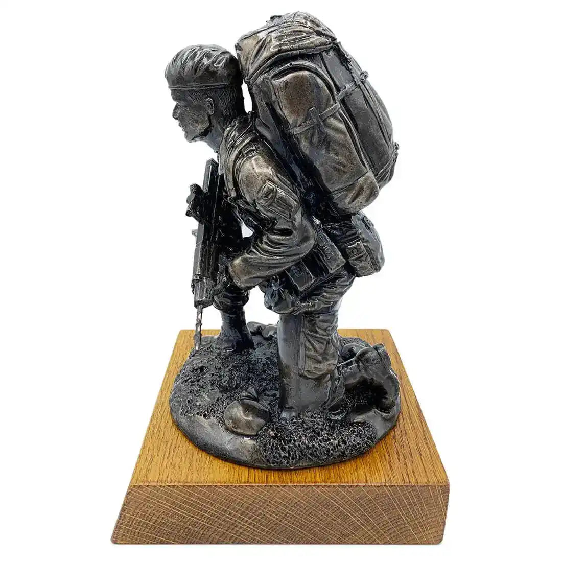 Side view of Kneeling Combat Figure with Beret Bronze Statue featuring detailed bergen backpack and SA80 rifle, mounted on solid oak base.  from  John Bull Clothing 
